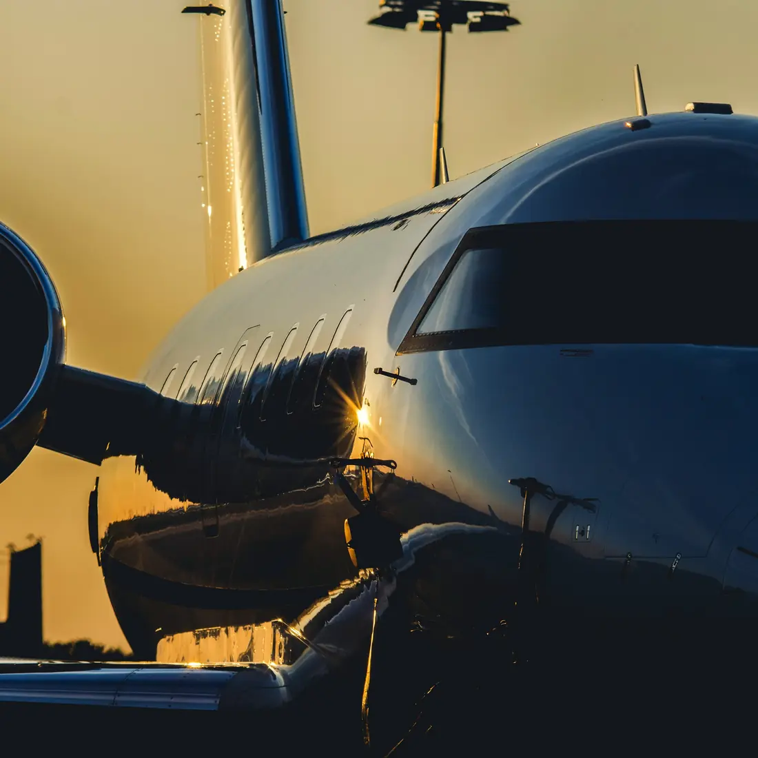 Business jet on the ramp at golden hour